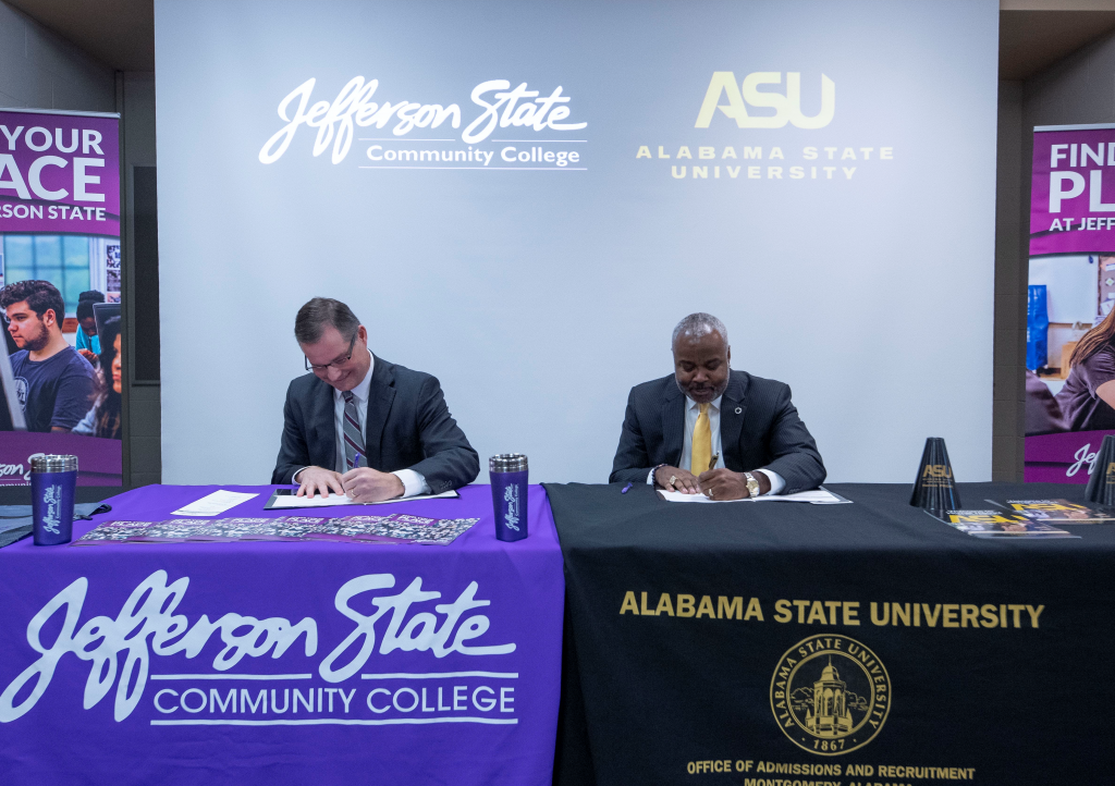 (Photo credit: David Campbell/ASU) - Jefferson State President Keith Brown (L) and Dr. Quinton Ross, Jr. sign an agreement to benefit students.