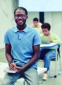 Student with blue shirt in a STEM classroom