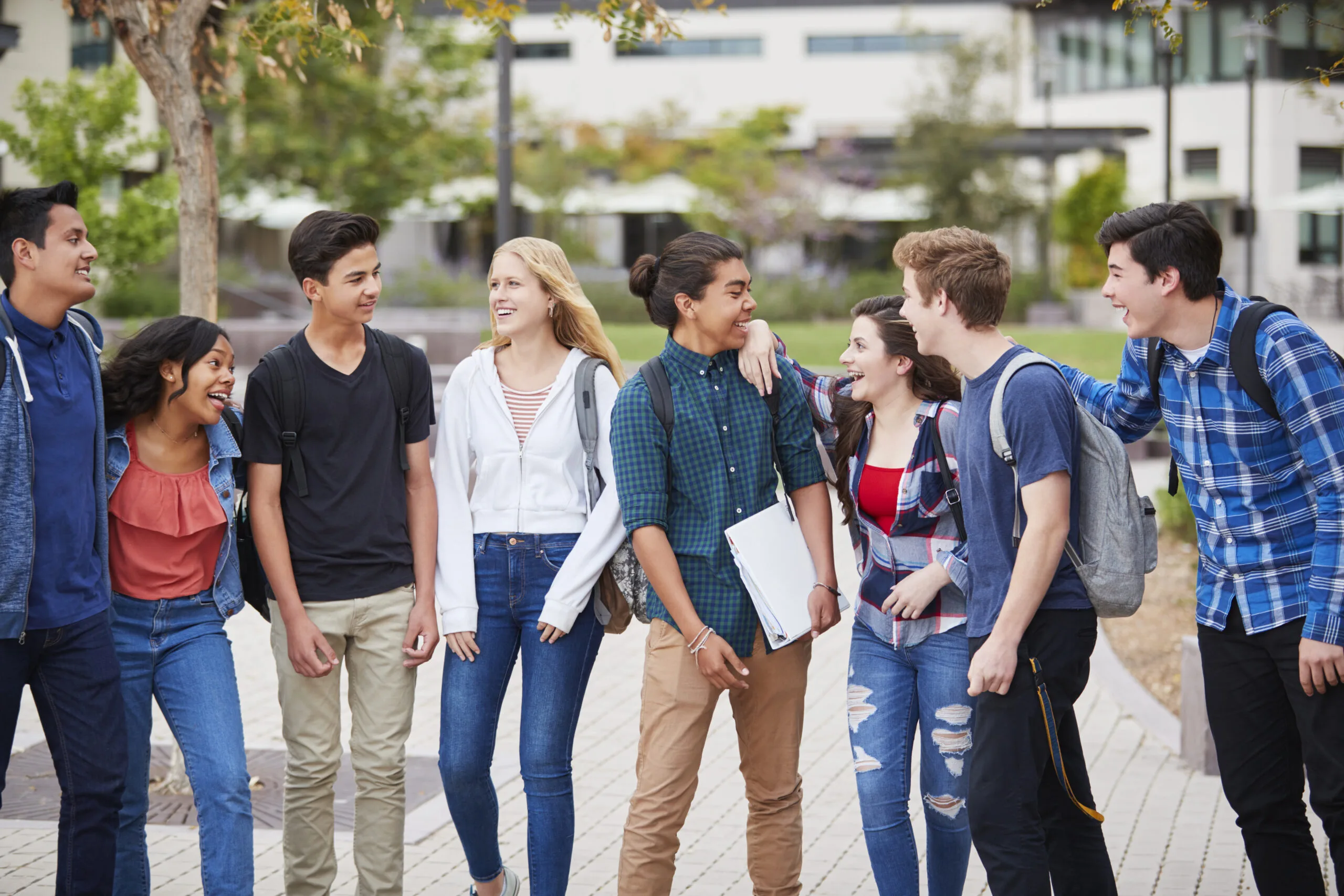 High School Students Socializing Outside College Buildings
