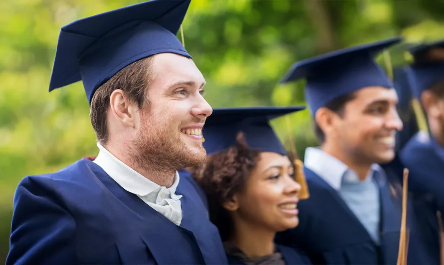 A group of people in graduation caps.