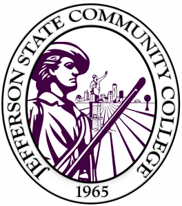 Seal of Jefferson State Community College featuring a statue of a colonial figure with a cityscape and industrial structures in the background, encircled by the college’s name and the year 1965.