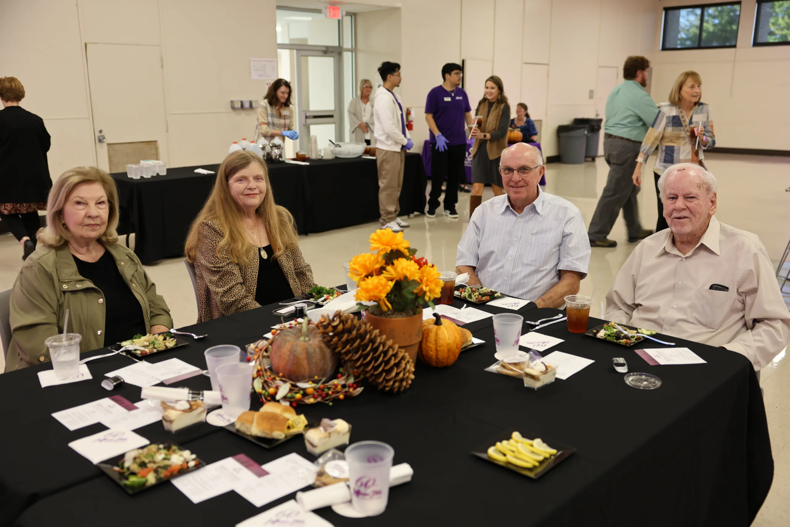 2025 Retiree luncheon attendees eating lunch.