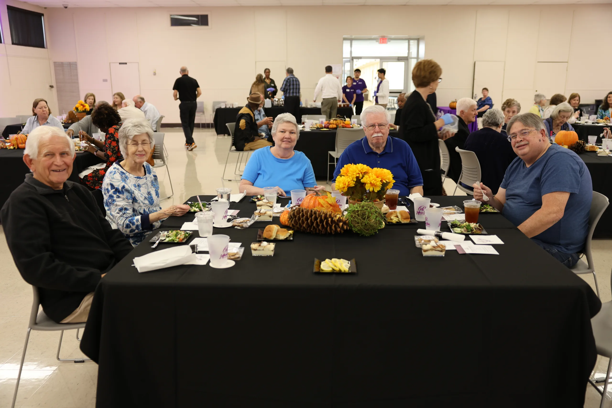 2025 Retiree luncheon attendees eating lunch.