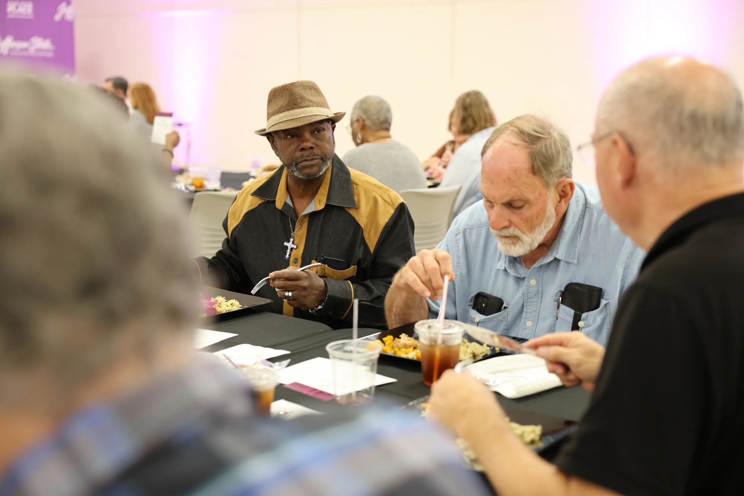 2025 Retiree luncheon attendees eating lunch.