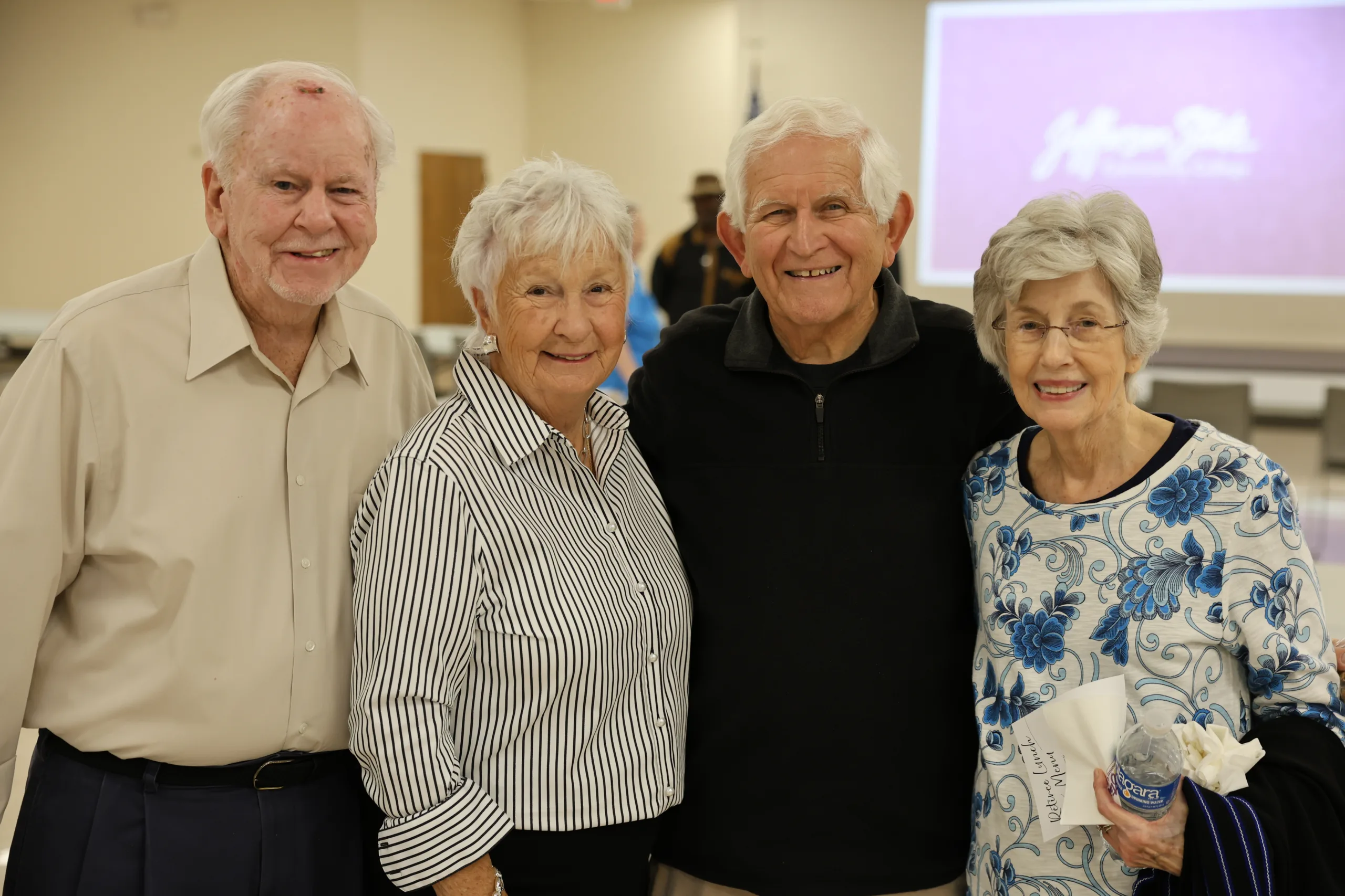 2025 Retiree luncheon attendees pose for picture.