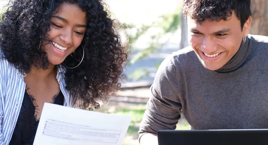 Students going over financial aid paperwork.