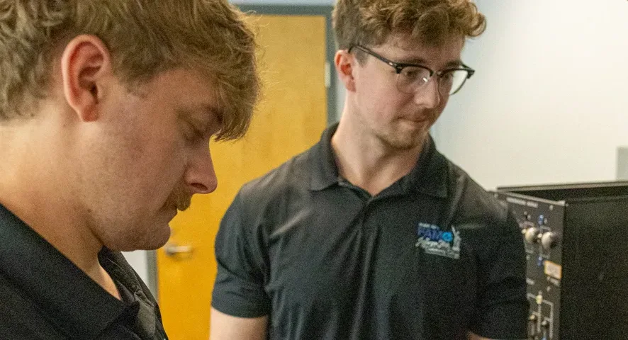 Male students in Mechatronics lab