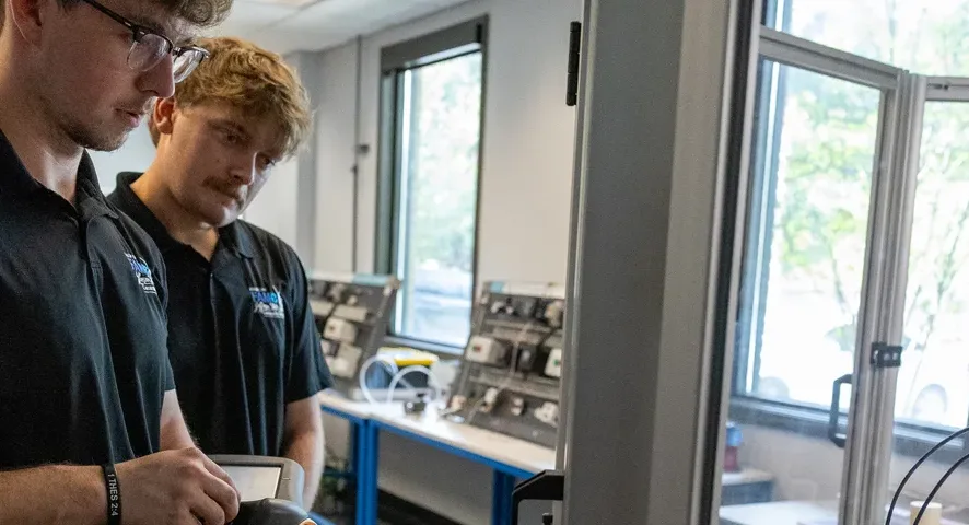Male students in Mechatronics lab