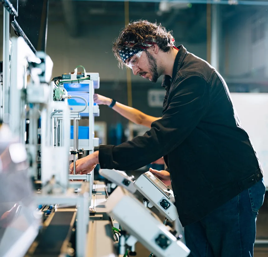 Automotive technician works with electronic equipment