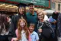 Graduate pose for picture with family