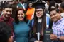 Graduate pose for picture with family