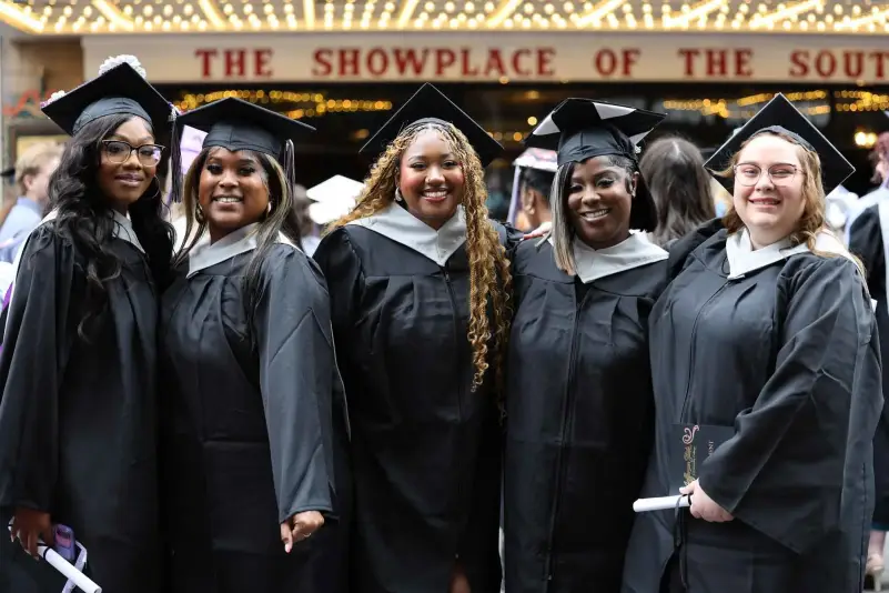 Graduates pose for picture