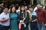 Graduate pose for picture with family