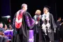 President Brown hands out diploma at ceremony