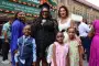 Graduate pose for picture with family