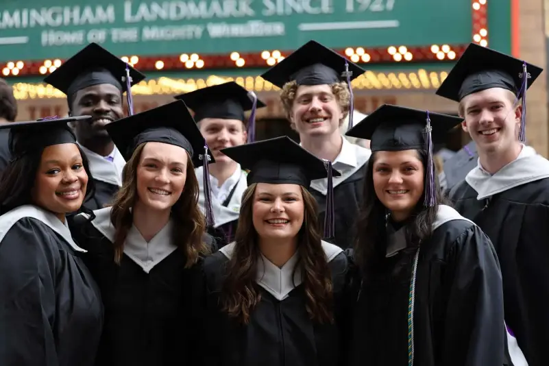 Graduates pose for picture