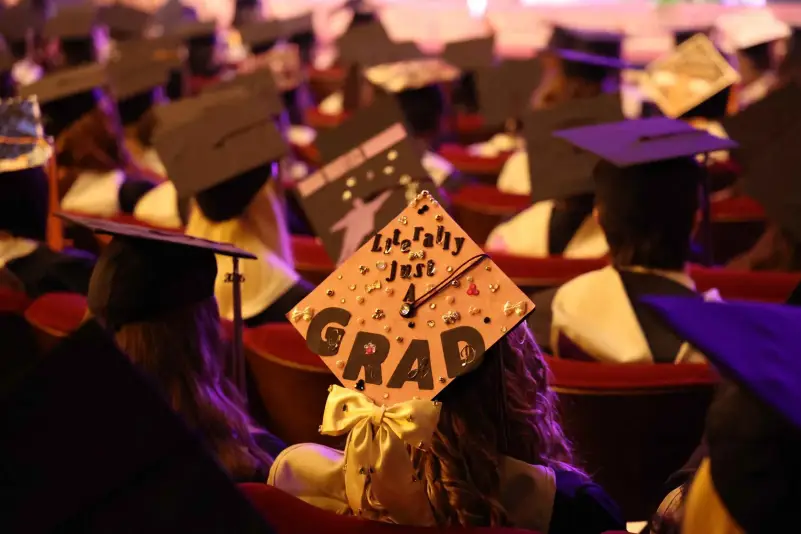 Graduates listen to commencement speaker