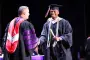 President Brown hands out diploma at ceremony