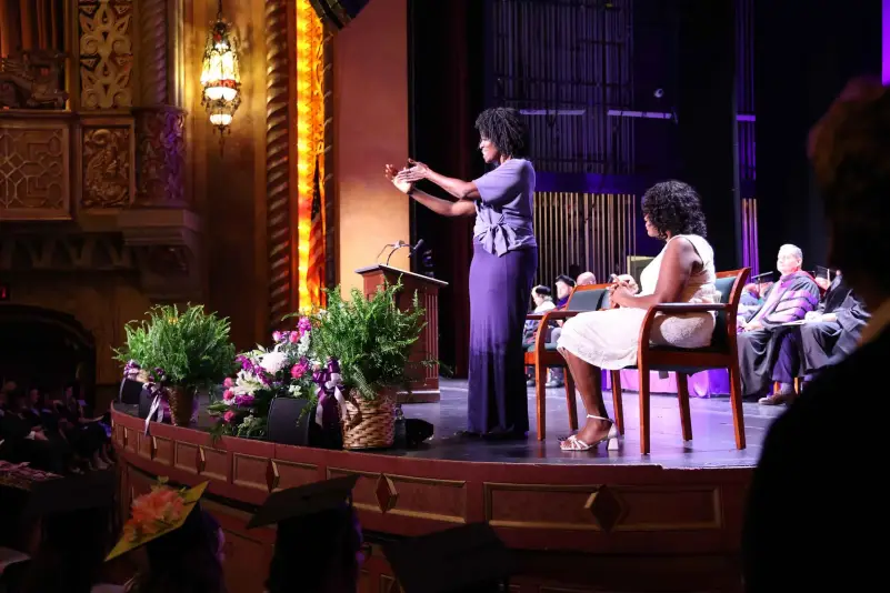 A sign language interpreter at graduation ceremony