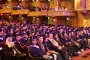 Graduates listen to commencement speaker