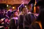 Graduate wait in line for name to be called for diploma