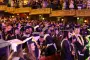 Graduates standing at graduation ceremony