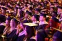Graduates listen to commencement speaker