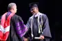 President Brown hands out diploma at ceremony