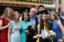 Graduate pose for picture with family