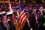 Graduates stand for flag ceremony