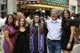 Graduate pose for picture with family
