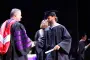 President Brown hands out diploma at ceremony