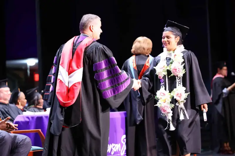 President Brown hands out diploma at ceremony