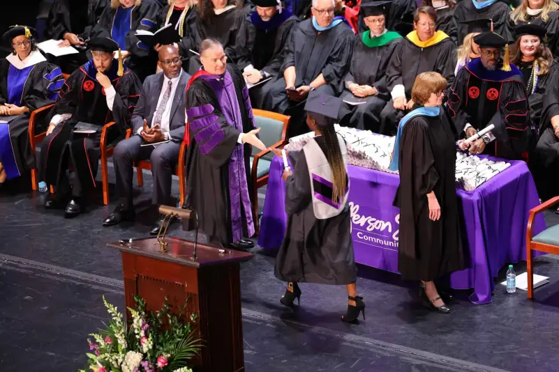President Brown hands out diploma at ceremony