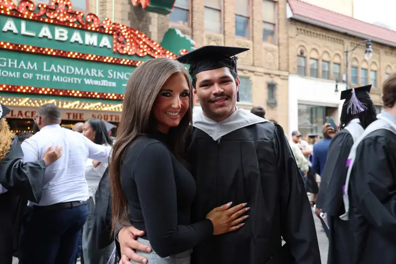 Graduate pose for picture