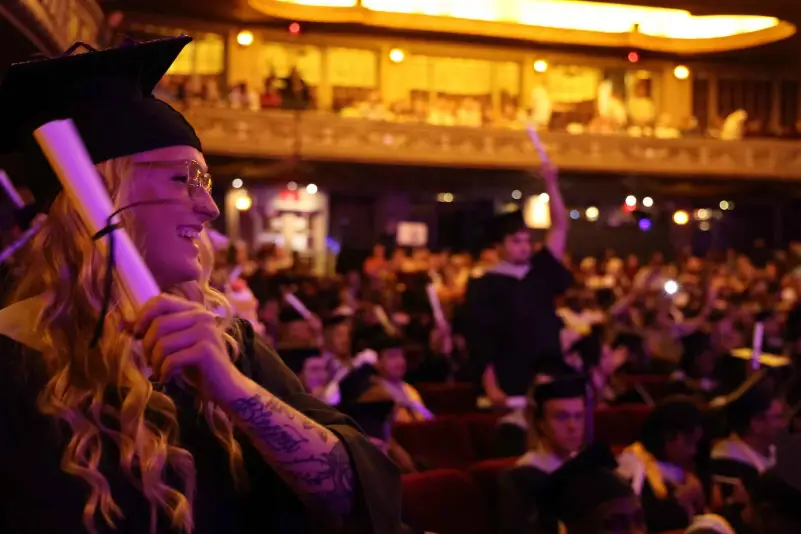 Graduate smile with scroll